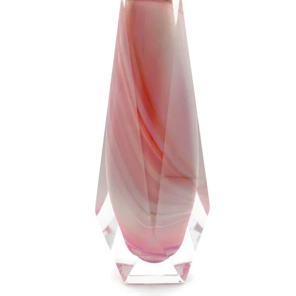 The image shows a beautiful tall, slender vase with a pinkish-red color that transitions from a darker tone at the top to a lighter shade towards the bottom. The vase has an irregularly shaped neck and appears to be made of glass, suggesting it might be a product of Murano glass craftsmanship, which is known for its distinctive colors and intricate designs. The background is a simple gradient that allows the vase to stand out prominently. The image is well-lit, highlighting the smooth texture and delicate curves of the piece.