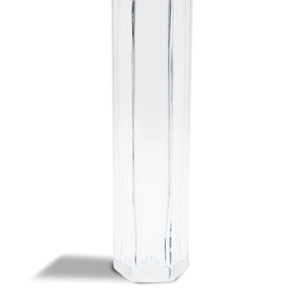 The image shows a tall, slender, clear glass vase with vertical ridges along its sides. The design gives it an elegant and modern appearance, reminiscent of Murano glassware from Italy, which is known for its intricate designs and craftsmanship. The vase appears to be made of Venetian crystal or similar high-quality materials. It stands out against a neutral background that complements the transparency and simplicity of the piece.