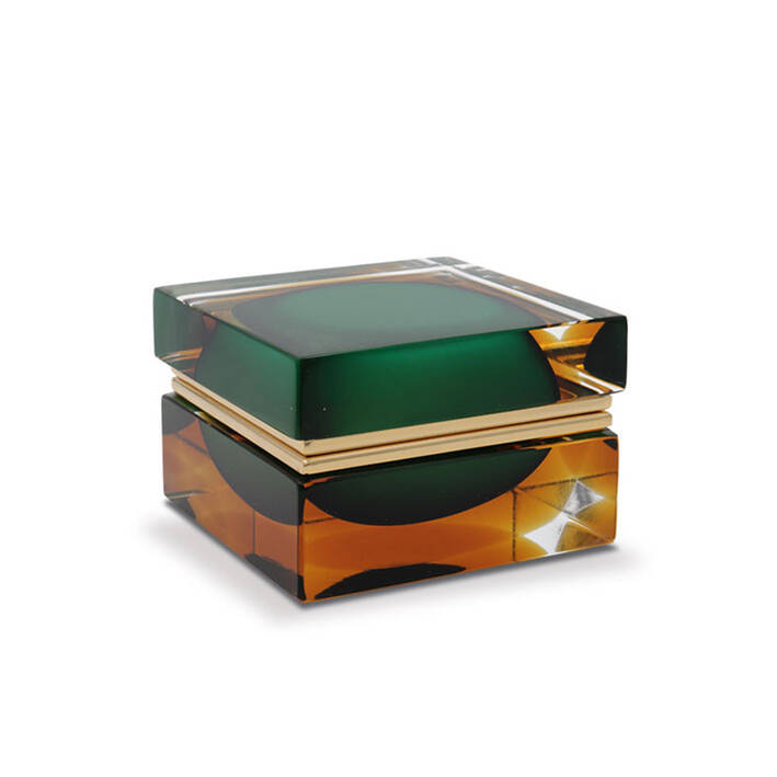 This image features a piece of Murano glass, which is known for its intricate designs and high-quality craftsmanship. The item appears to be a jewelry box with a lid that has an ornate design featuring different shades of green and gold, suggesting a luxurious and handcrafted finish. The brand 