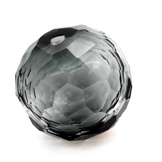 The image shows a spherical object made of Murano glass, characterized by its intricate pattern and multiple layers. This type of glassware is associated with the Venetian island of Murano, known for producing high-quality glass items such as vases, chandeliers, and decorative objects. The craftsmanship evident in this piece reflects the tradition and skill involved in creating these unique designs. The coloration appears to be a deep blue or black with lighter reflections that suggest the glass is multi-faceted, possibly resembling crystal or gemstones. This style of glasswork is often highly valued for its beauty, rarity, and the artistry it represents from one of Italy's most famous regions for glassmaking.